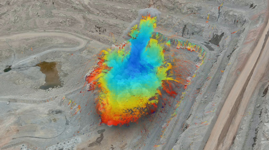 A close-up bird's eye view of a mining site with a GroundProbe BlastVision software heatmap layer on top of the photo to highlight slope instability
